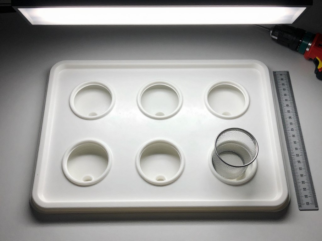Storage container lid with evenly spaced holes for net pots Storage container lid with evenly spaced holes for net pots